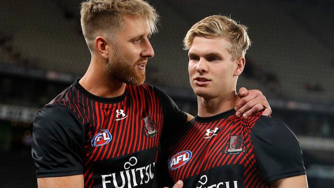 Essendon skipper Dyson Heppell with Ben Hobbs before his first game. Picture: Dylan Burns/AFL Photos via Getty Images