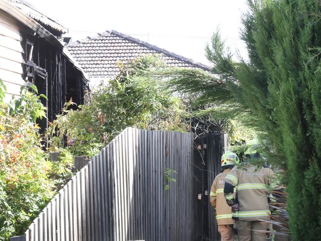 A mother stayed inside the burning home with her wheelchair bound daughter until firefighters arrived to rescue the pair. Picture: David Crosling