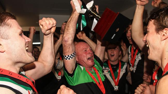 EFNL: Outgoing Donvale coach Kevin Collins celebrates with the 2023 Division 3 cup. Picture: Davis Harrigan