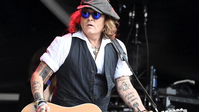 Johnny Depp performs on stage with Jeff Beck during the Helsinki Blues Festival in Helsinki, Finland. Picture: AFP