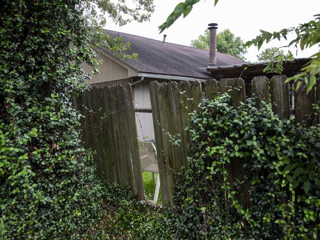 The hole in the fence where intruders entered the home. Picture: Scott Dalton