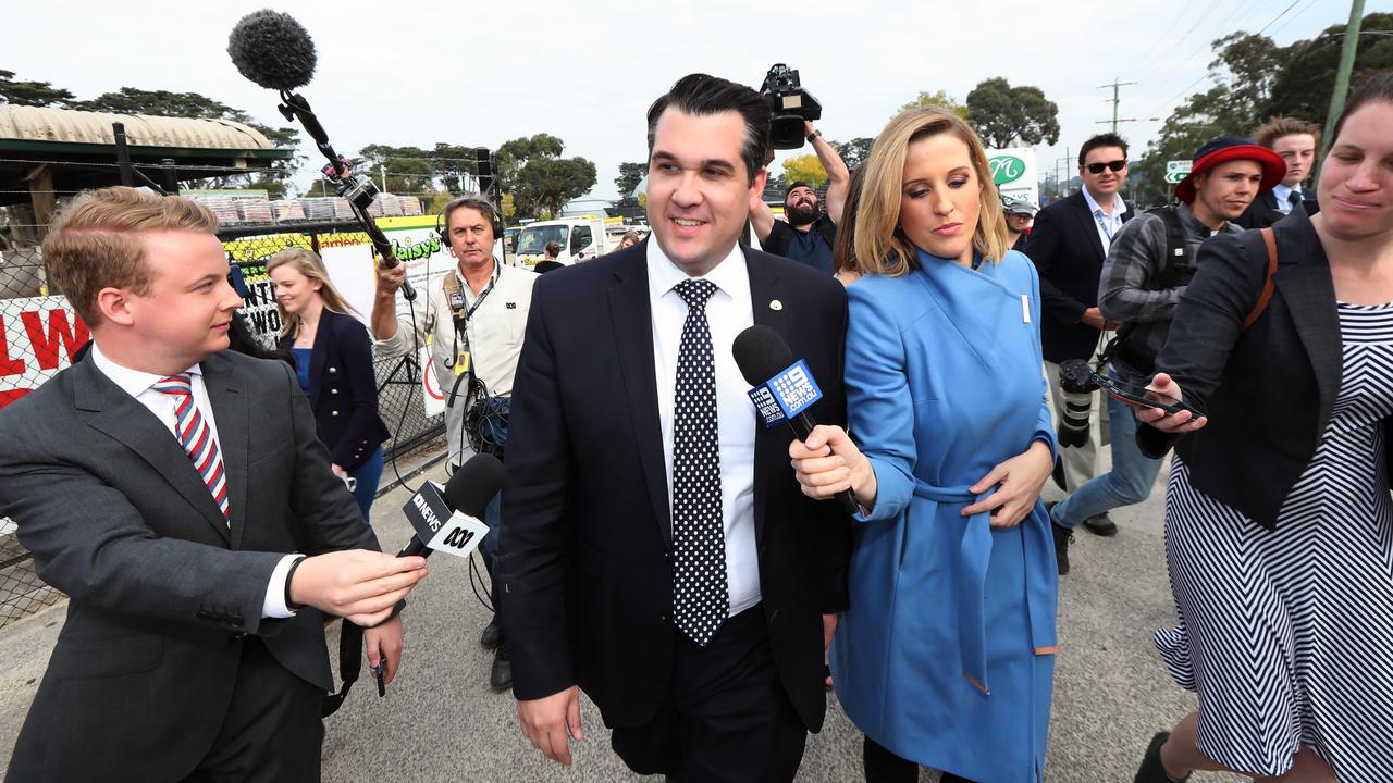 Michael Sukkar tries to dodge the media pack after he appeared with Scott Morrison.