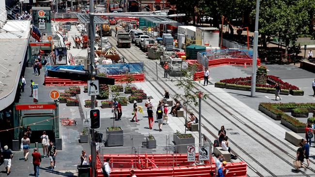 Light rail work continues along George St between Park and Bathurst Streets outside Town Hall. Picture: Toby Zerna