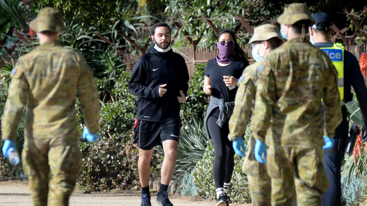 Police and ADF personnel at the Tan track in Melbourne. Picture: Andrew Henshaw/NCA NewsWire.
