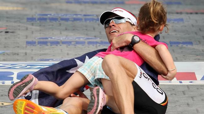 A spent Craig Alexander after winning the 2008 Hawaii ironman triathlon.