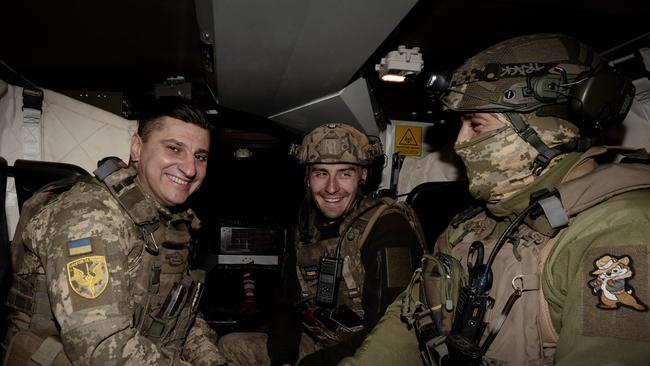 Ukrainian soldiers demonstrate an Australian Bushmaster in Ukraine’s east. Pictured are Captain Matviy, Murava (pseudonym) and Tur (pseudonym). Picture: Liam Mendes