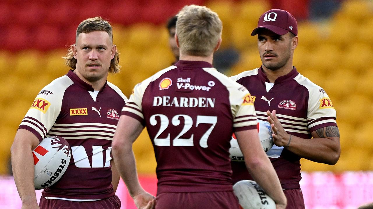 Reuben Cotter, Tom Dearden and Valentine Holmes chat during a Queensland Maroons State of Origin captain's run at Suncorp Stadium on July 16, 2024 in Brisbane, Australia. (Photo by Bradley Kanaris/Getty Images)