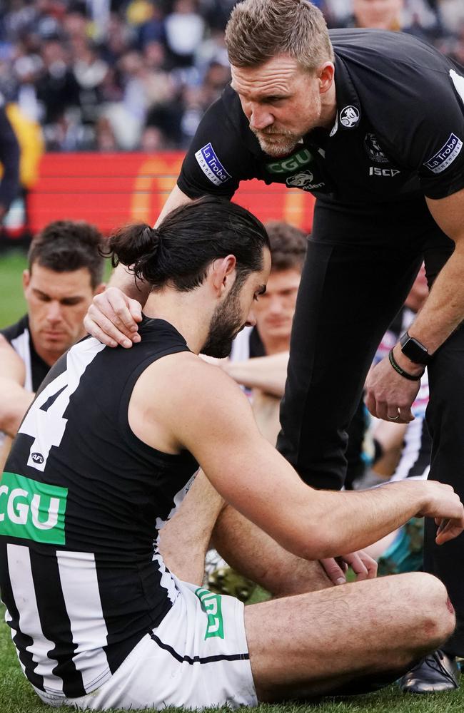 Nathan Buckley consoles Brodie Grundy after the Grand Final.