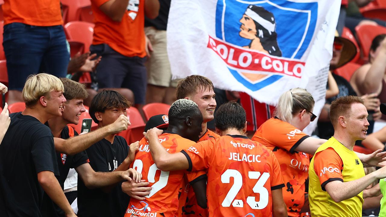 Roar players celebrate with fans during Brisbane’s win over the Victory. Picture: Chris Hyde/Getty Images