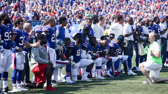 Buffalo Bills players kneel during the American National anthem before an NFL game against the Denver Broncos. Picture: AFP