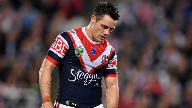 Cooper Cronk reacts after injuring his shoulder during the NRL preliminary final match between the Sydney Roosters and the South Sydney Rabbitohs at Allianz Stadium. Picture: AAP