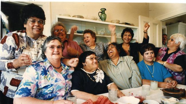 Hindmarsh Island Bridge Royal Commission. Bertha Gollan (second left in front row) celebrates with her fellow dissident Ngarrindjeri women Beryl Kropinyeri, Betty Tatt, Audrey Dix, Dulcie Wilson, Bertha Gollan, Dorothy Wilson and Veena Gollan in Bertha's kitchen in 1995. Picture: Chris Mangan