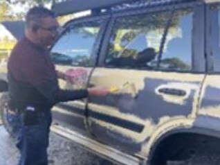 Greg Lynn was photographed by his wife, Melanie, repainting his car on June 4, 2020. Picture: Supreme Court of Victoria.