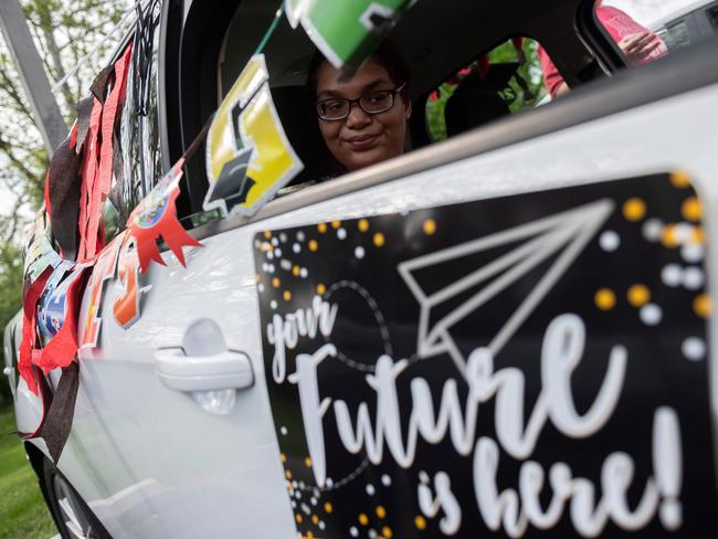 A student from North Hagerstown High School, waits to take part in a "senior ride", after the traditional prom was cancelled due to the coronavirus. Picture: AFP