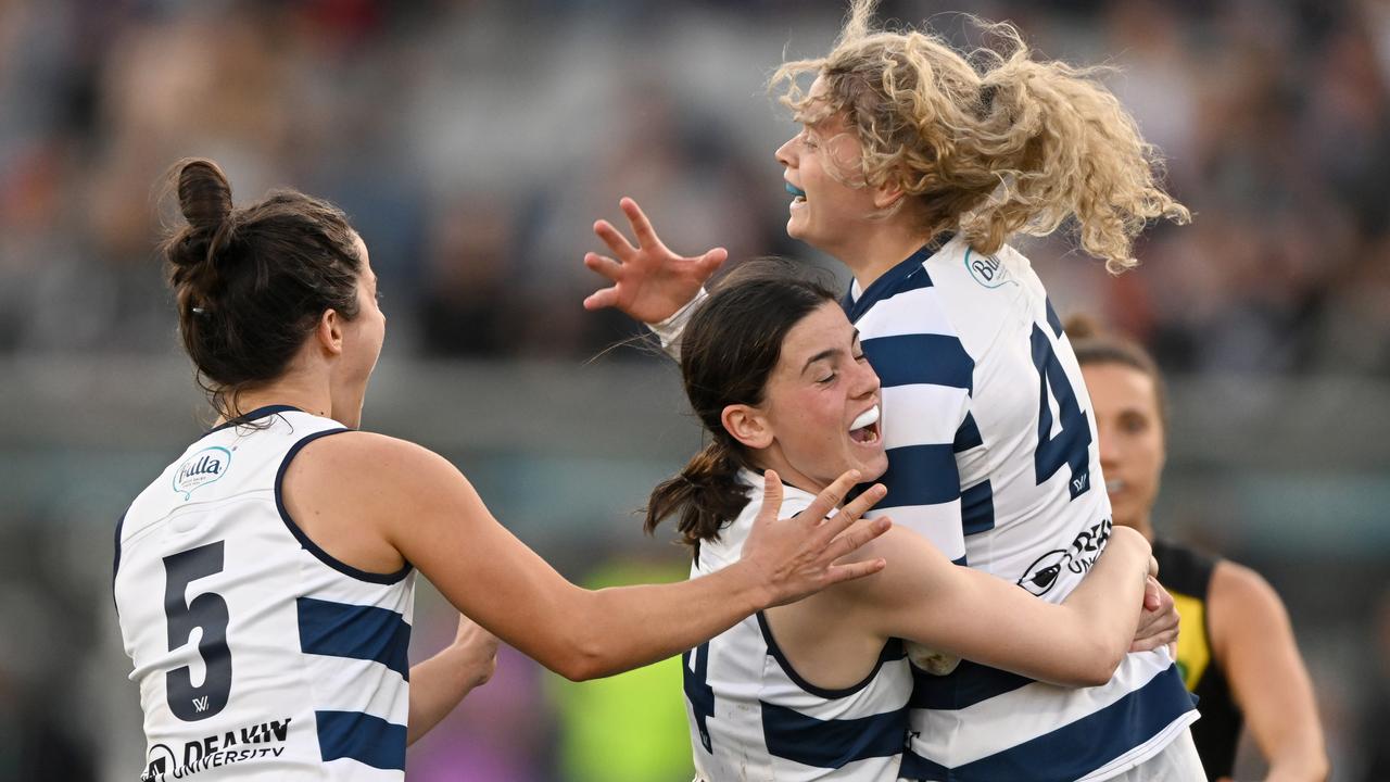 GEELONG, AUSTRALIA - AUGUST 28: Georgie Prespakis of the Cats celebrates a goal with team mates during the round one AFLW match between the Geelong Cats and the Richmond Tigers at GMHBA Stadium on August 28, 2022 in Geelong, Australia. (Photo by Morgan Hancock/AFL Photos/via Getty Images)