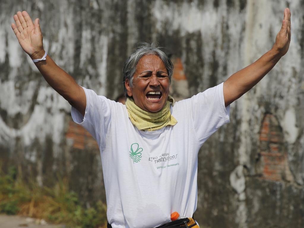 A demonstrator tries to stop the violence during clashes with the Bolivarian National Guard over blocked humanitarian aid to Venezuela. Picture: AP Photo/Fernando Llano