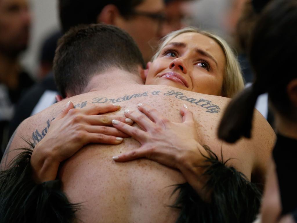 Jeremy Howe is consoled. (Photo by Darrian Traynor/AFL Media/Getty Images)