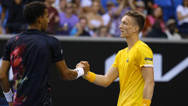 Jiri Lehecka is congratulated by Felix Auger-Aliassime.