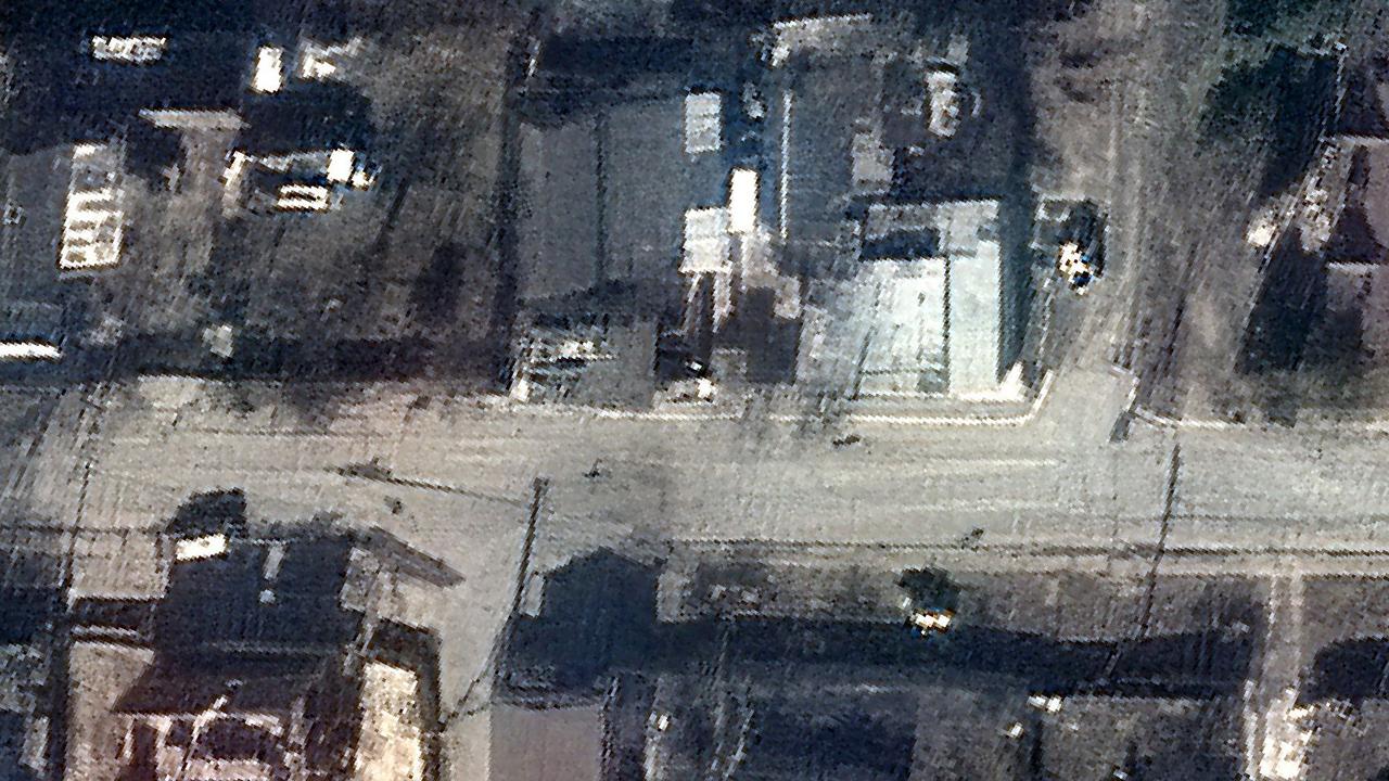 A saelitte image of Bucha, near Kyiv, shows bodies left in the streets after Russian troops invaded the town. Credit: AFP PHOTO /Satellite image Â©2022 Maxar Technologies