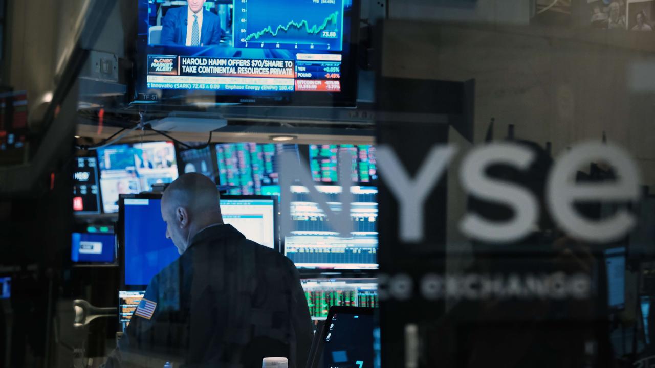 Traders work on the floor of the New York Stock Exchange following an economic “bloodbath”. Picture: Spencer Platt/Getty Images/AFP