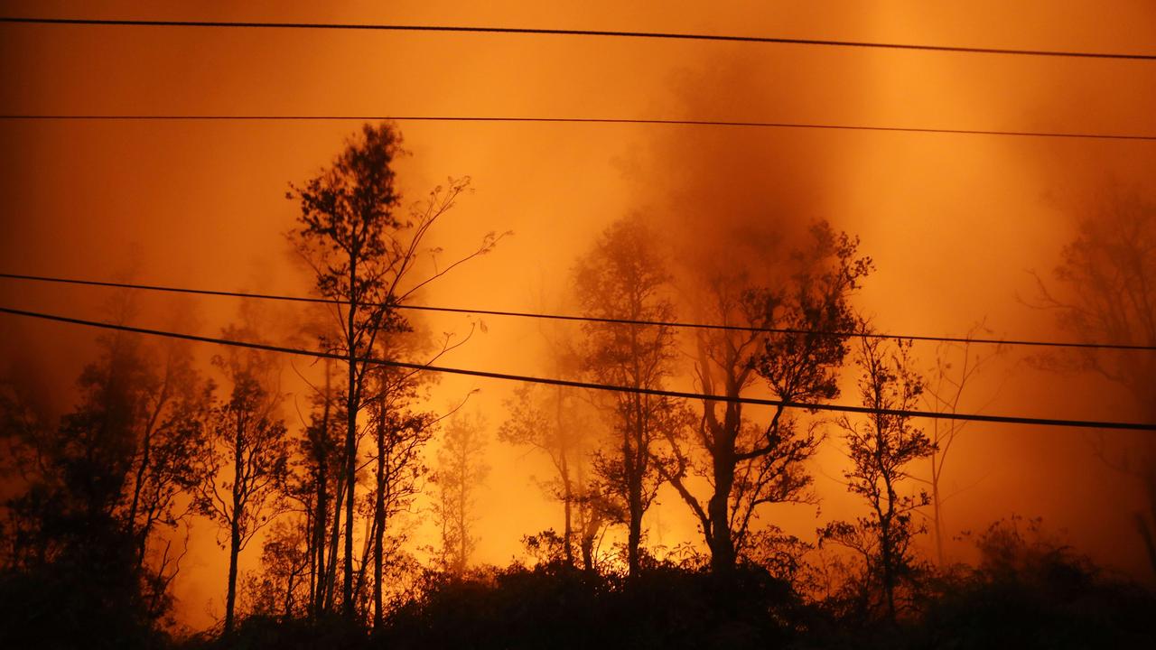 Lava illuminates volcanic gases from the Kilauea volcano at one of the fissures. Picture: Mario Tama/Getty Images/AFP