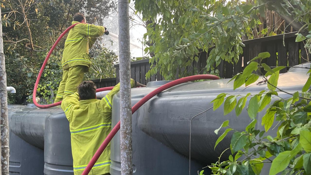 Firefighters extinguishing a house fire on Hamilton Island. Picture: Rory Wynbergen