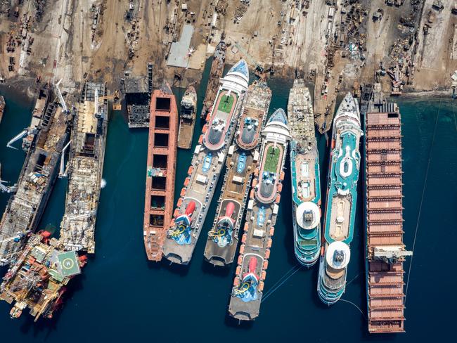 IZMIR, TURKEY - OCTOBER 02: In this aerial view from a drone, five luxury cruise ships are seen being broken down for scrap metal at the Aliaga ship recycling port on October 02, 2020 in Izmir, Turkey. With the global coronavirus pandemic pushing the multi-billion dollar cruise industry into crisis, some cruise operators have been forced to cut losses and retire ships earlier than planned. The cruise industry has been one of the hardest hit industries with public confidence in cruise holidays plummeting after a series of outbreaks occurred on cruise liners as the pandemic spread. The crisis however has bolstered the years intake of ships at the Aliaga ship recycling port with business up thirty percent on the previous year.  (Photo by Chris McGrath/Getty Images)