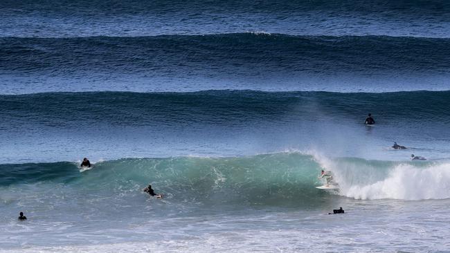 Surfers at Snapper Rocks. Picture: Luke Marsden.