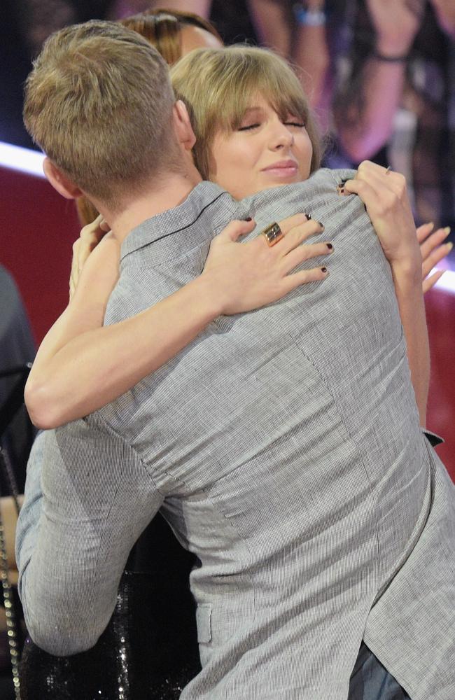 Taylor Swift hugs Calvin Harris at the iHeartRadio Music Awards. Picture: Getty