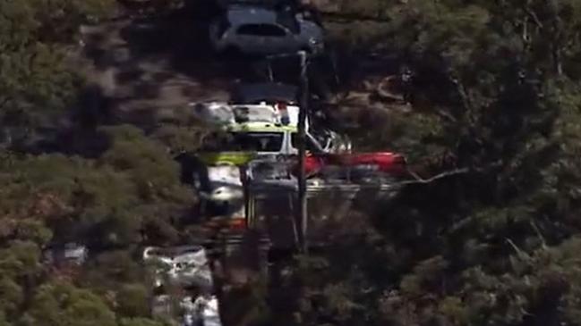 Emergency crews at the scene where two hikers fell from a ledge at Witches Falls on Tamborine Mountain. Picture: 7 News Gold Coast