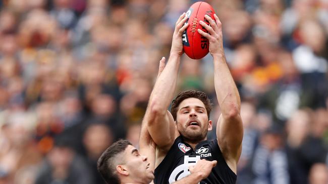 Levi Casboult climbs above Tyson Stengle to mark. Picture: Michael Willson/AFL Photos via Getty Images.