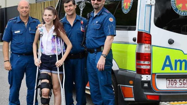 ON THE MEND: Accident survivor Colleen Tabone of Lowood thanks ambulance paramedics (from left), Peter Brown, Alex Henderson and Paul Beswick. INSET: Ms Tabone’s car shortly after the crash. Picture: David Nielsen