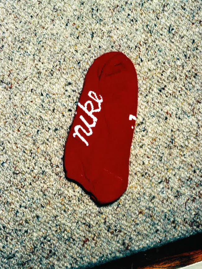 A red sock found in the hallway of her home.