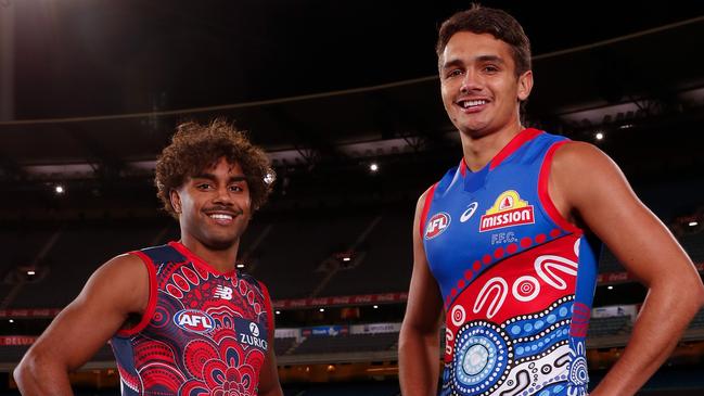 MELBOURNE, AUSTRALIA - MAY 19: Kysaiah Pickett of the Demons and Jamarra Ugle-Hagan of the Bulldogs pose for a photograph during the 2021 Indigenous Round Media Opportunity at the Melbourne Cricket Ground on May 19, 2021 in Melbourne, Australia. (Photo by Michael Willson/AFL Photos via Getty Images)