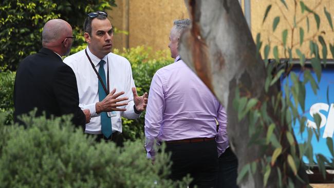 Police officers, including Detective Inspector Mick Haddow, commander of the Sex Crimes Squad, on the grounds of Channel 9. Picture: Phil Hillyard