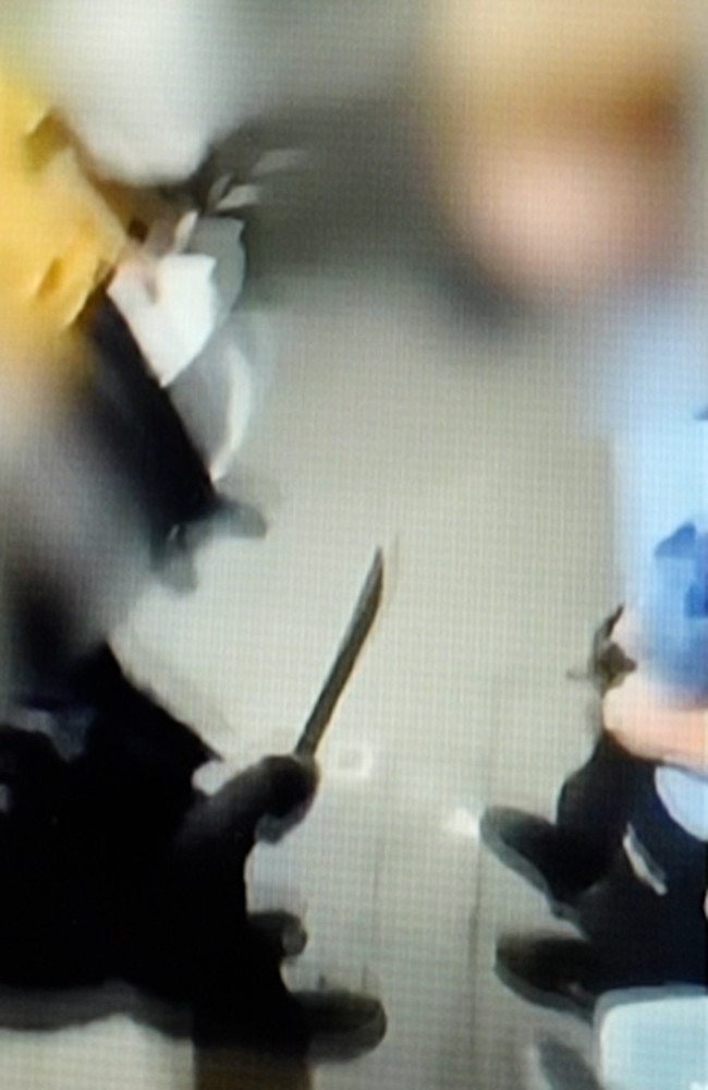 A huge machete is shoved in the face of a schoolboy. Picture: Supplied
