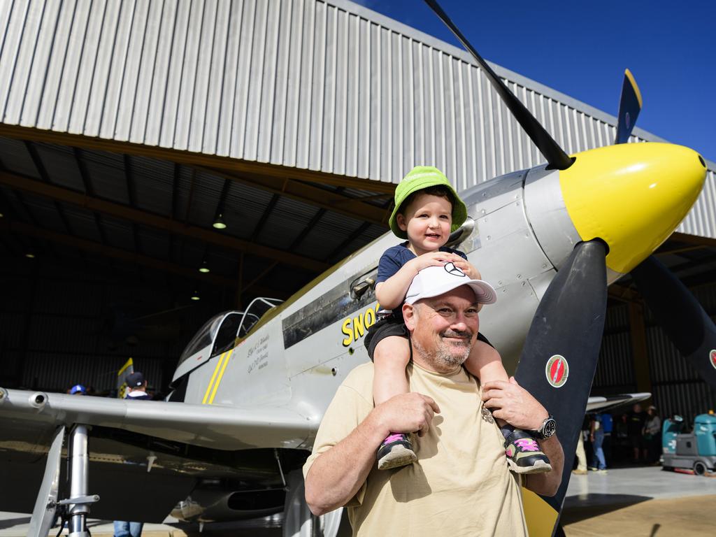 Vance Dean gets a good look at the P-51 Mustang WWII fighter from the shoulders of uncle Craig Scotts at the David Hack Classic, Sunday, May 18, 2025. Picture: Kevin Farmer