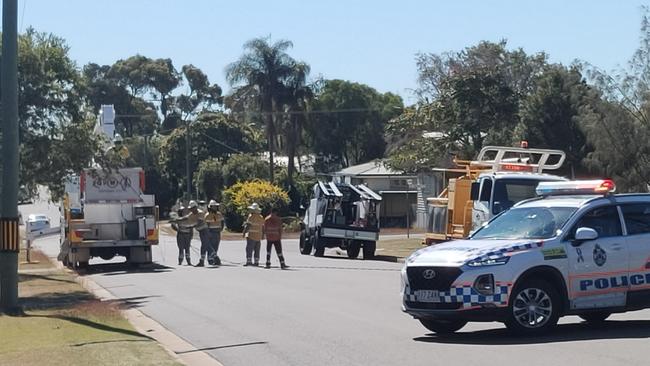 The scene of a crash at Barney Point where a white Holden ute hit a power pole snapping it in half.