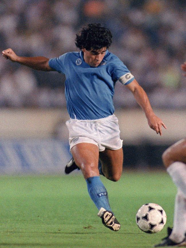 Argentina soccer superstar Diego Maradona of S.S.C Napoli is about to shoot a ball to the goal during the Xerox Super Soccer against Japan's National Team in Tokyo in 1988.