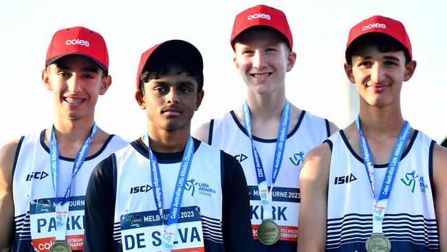 Zach Kirk (VIC), Darcy Parker (VIC), Kevin De Silva (VIC) and Lachlan Rosato (VIC) pose on the podium after winning the Boys U13 Medley Relay during the Australian Little Athletics Championships at Lakeside Stadium in Albert Park, Victoria on April 23, 2023.