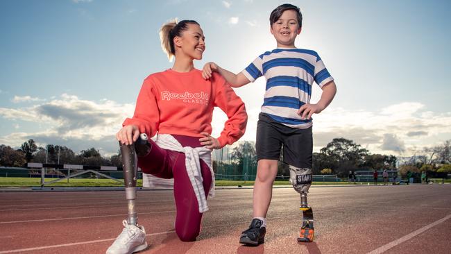 Former RCH patient and Paralympian Kelly Cartwright, with 7-year-old Hamish Cain. Picture: Jason Edwards