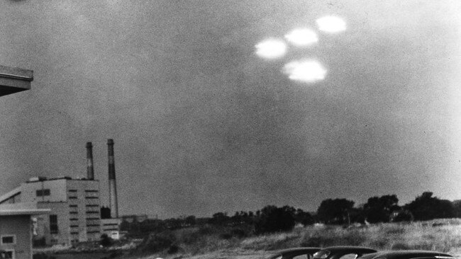 Four brightly glowing, unidentified objects appeared in the sky at 9:35am on July 15, 1952 over a parking lot in Salem, Mass. Picture: Getty Images