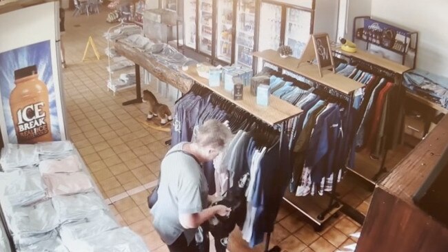 A woman has been caught on CCTV appearing to take shirts from a Queensland roadhouse. Picture: Supplied