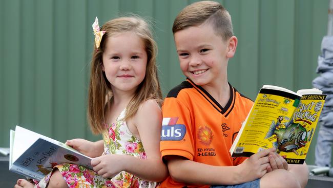 Isaac Green, 8, and sister Ella, 6, go to the library with their mother each week to pick out books they enjoy reading. Picture: Mark Calleja