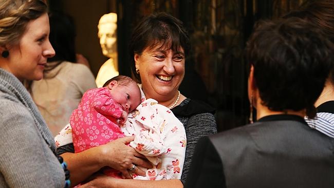 Maureen Shelley with the daughter of one The Copy Collective's independent contractors at the company's fifth birthday party in July.