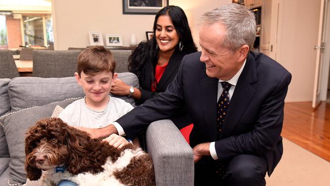 Opposition Lader Bill Shorten and Labor candidate for Deakin Shireen Morris chats with Tom Davis, 10, in Melbourne on Thursday. Photo: WILLIAM WEST / AFP)