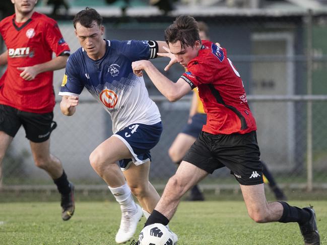 Leichhardt's Declan Macalister (right) battles Marlin Coast during the match at Trinity Beach Picture: Brian Cassey