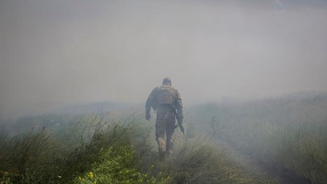 A Ukrainian service member near the newly liberated village of Neskuchne in the Donetsk region on Tuesday. Picture: Reuters