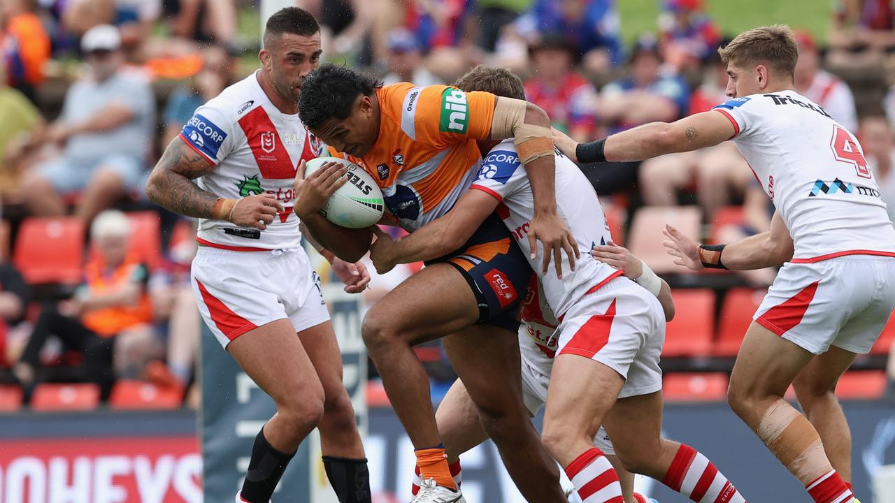Jacob Saifiti charges into the Dragons defence.