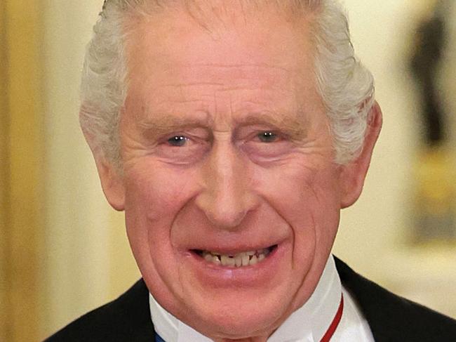 (FILES) In this file photo taken on November 22, 2022 Britain's King Charles III and Britain's Camilla, Queen Consort wearing a brooch depicting an image of the late Queen Elizabeth II, pose for a photograph during a State Banquet at Buckingham Palace in London on, at the start of the President's of South Africa's two-day state visit. - Buckingham Palace announced on March 3, 2023, that King Charles III's first state visit to France will start on March 26. It will take place shortly after a first visit to France by British Prime Minister Rishi Sunak on March 10 for a bilateral summit. (Photo by Chris Jackson / POOL / AFP)